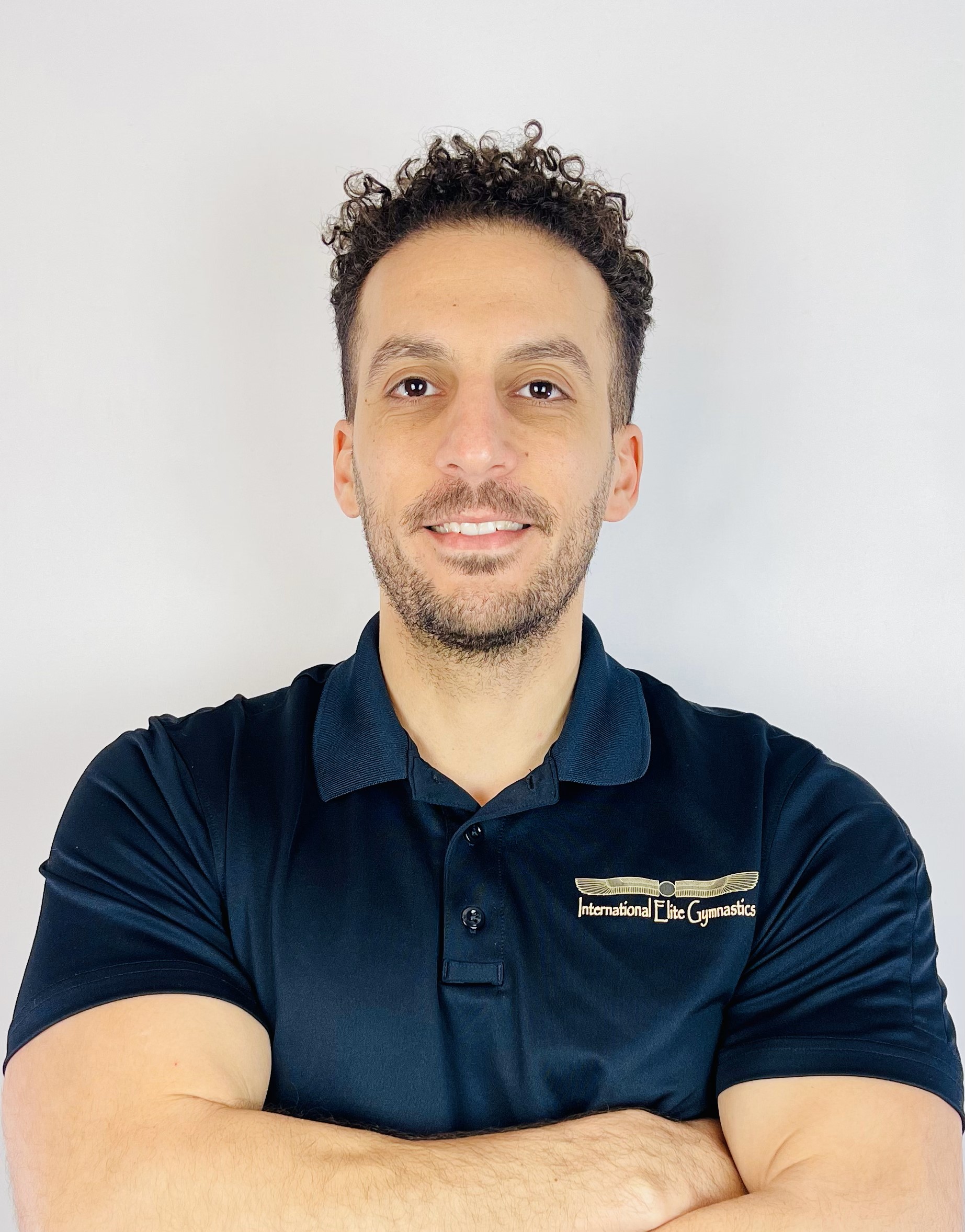 Image of Coach Hisham, coach for boys and girls gymnastics in Saint Paul.